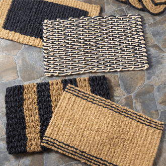 a group of black and tan coir door mats