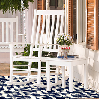 white wooden rocking chair and table on porch
